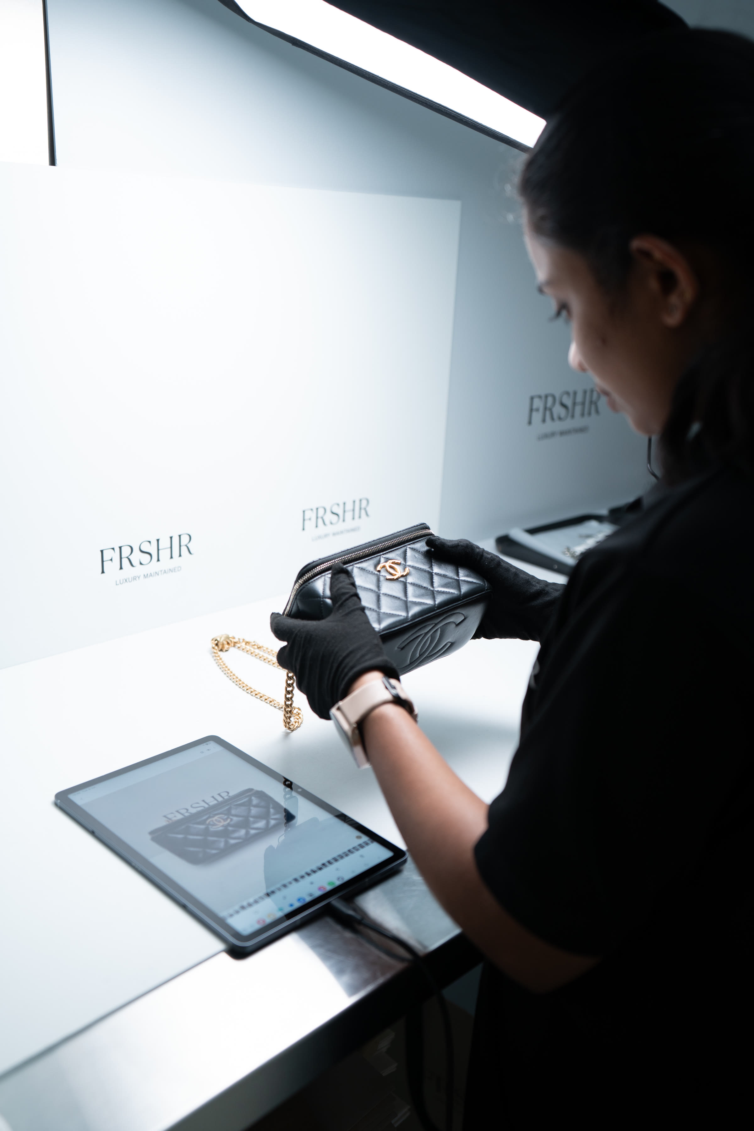 A specialist documenting a piece on arrival at the FRSHR workshop
